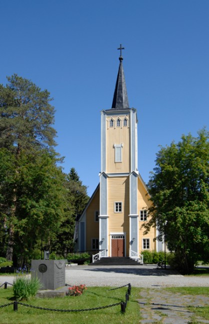 Muhos Church from the outside. Light church on a sunny day.
